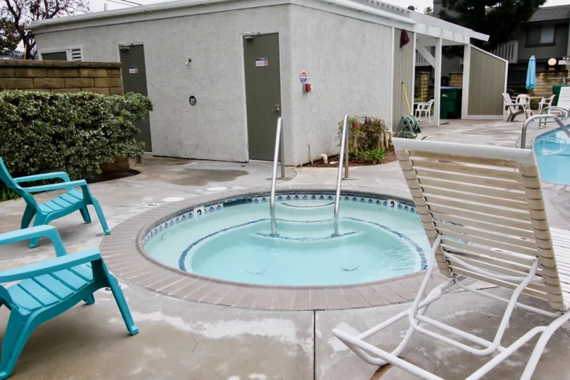 A circular baby pool in the pool area of a residential complex