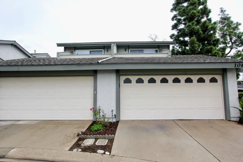 THE 106TH HOUSE IN THE TUSTIN PINES WITH THE FLOWER PLANT, TREES