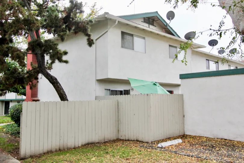 Villas having dish antennas and trees around in Tustin place of Tustin