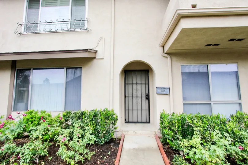 Security door access amoung mature, well-maintained landscaping at the Tustin Verdes community