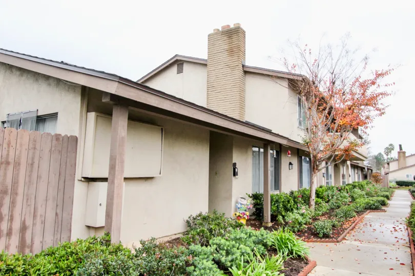 Entry area in the Tustin Verdes community in Tustin, California. Attractive landscaping along walkway and entrances.