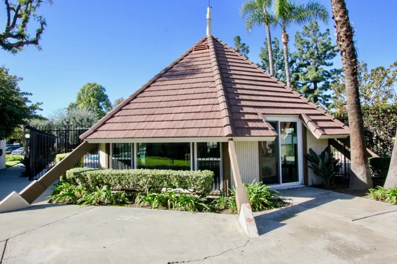 A pyramid shaped roof sits on a community room in the Tustin Village community