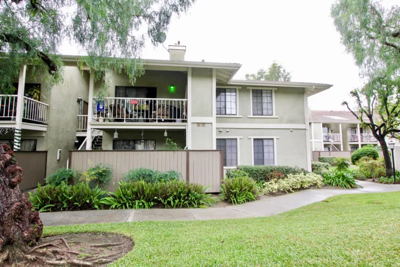 Awesome garden and lawn in front of a villa with balcony in Village Homes of Tustin