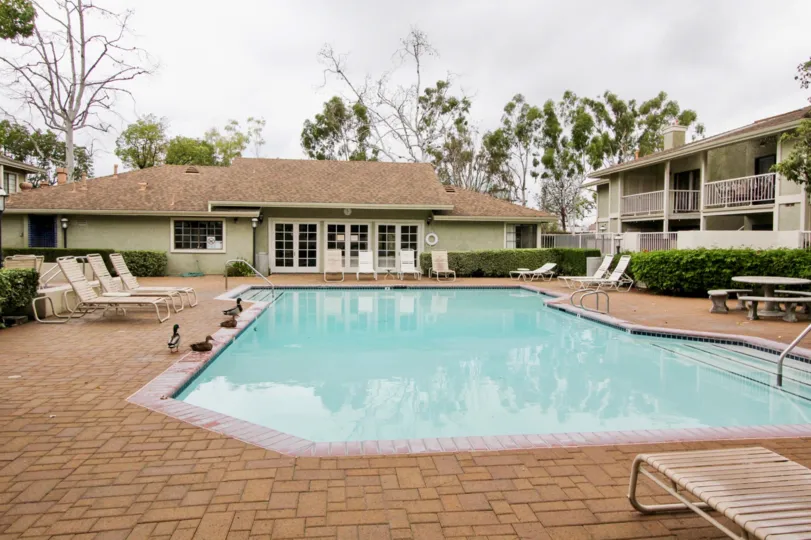 A public pool with stone paving in the Village Homes community.