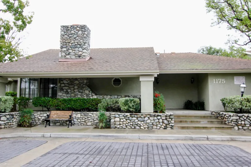 THE 1175 FLAT IN THE VILLAGE HOMES WITH THE STONE BENCH, PLANTS, TREES