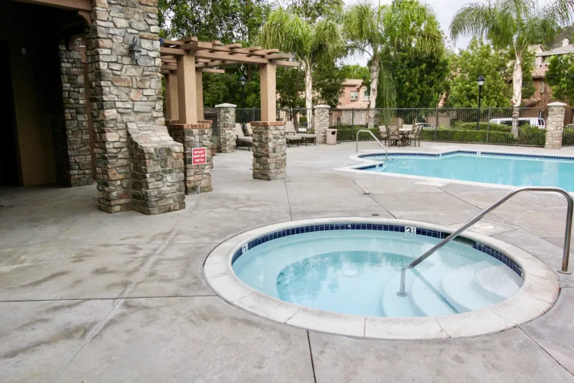 Two swmming pool located at a building that the pool for adult and kids.