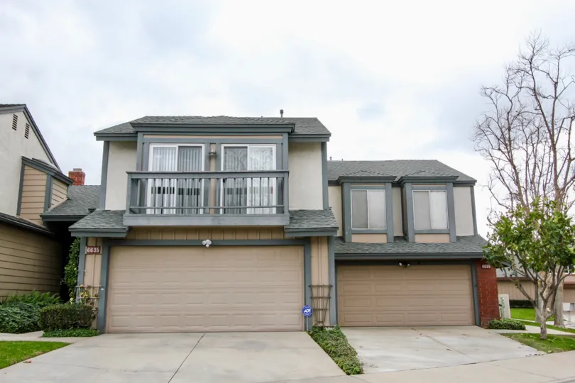 A nice day in the Charter Hill in front a house with balcony.