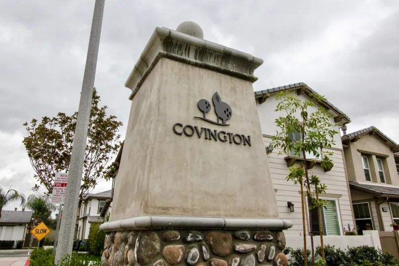 An entrance sign in fancy writing in Covington Classics community.
