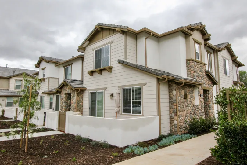 Outer View of a house in Covington Classics with corner view of building and garden