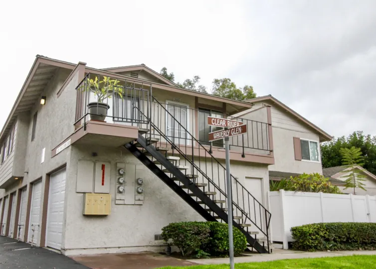 A cloudy day in the Fairmont Hill in front of the house with staircase.