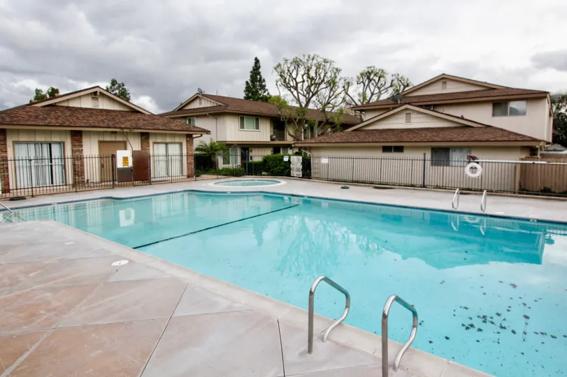 A cloudy day near a relaxing pool in the Jamestowne Homes community.