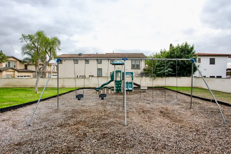 A cloudy day in the Jamestowne Homes with childrens park with buildings.