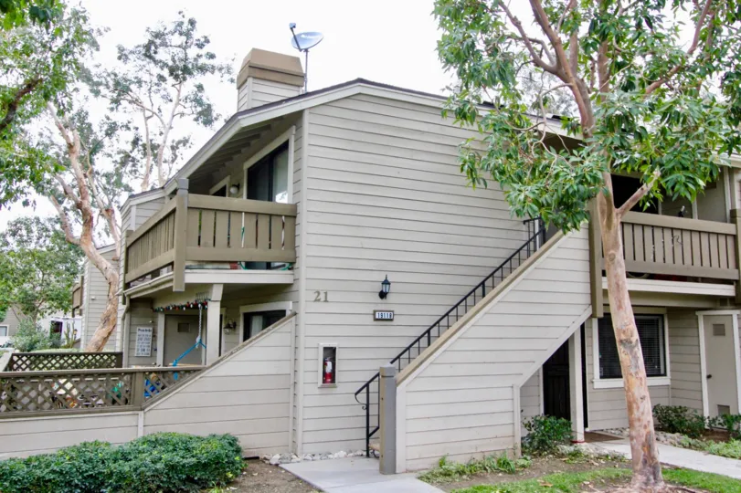 A single house located alone and trees also available at the morning time.