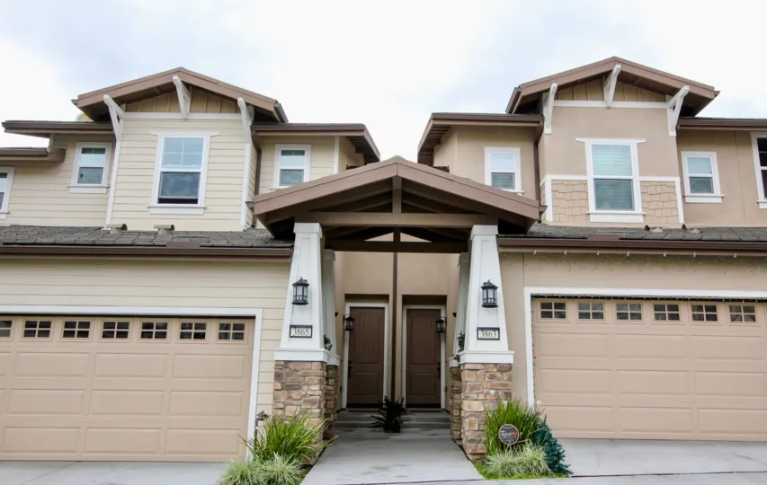 Entrance to two apartment buildings in Palisades at Vista Del Verde with garages.
