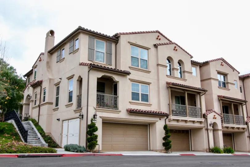 Palisades at Vista Del Verde Yorba Linda California blocks of floors with super balcony and twisted plants in front