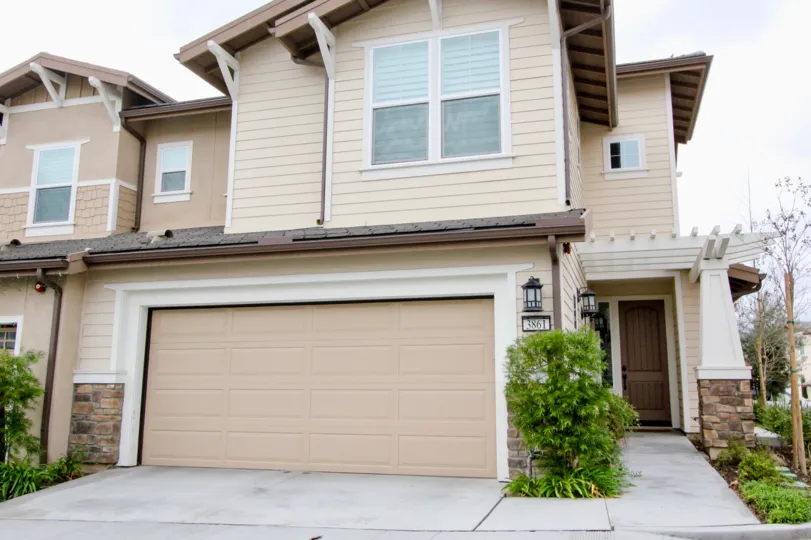 Palisades at Vista Del Verde Yorba Linda California with big walls and small front door side