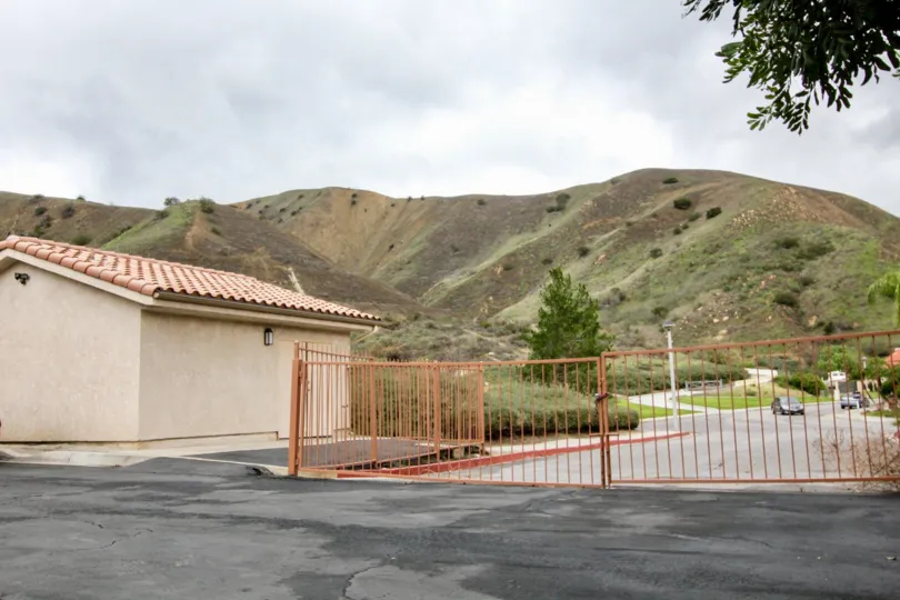 Spanish fenced home by mountains in The Hills, Yorba Linda CA