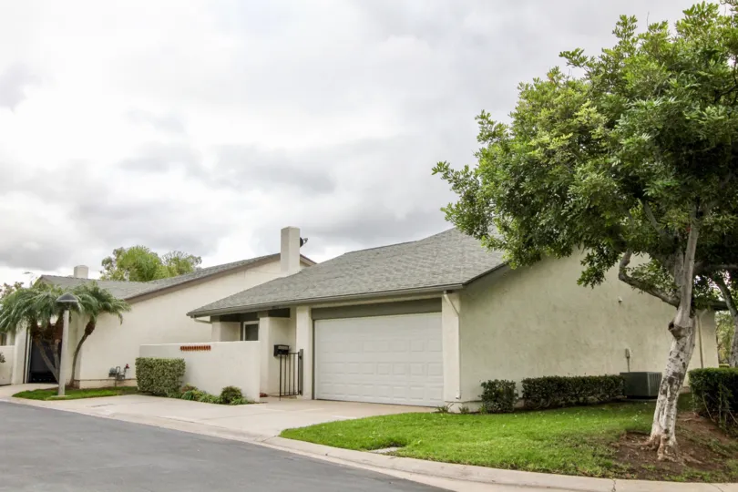 Woodgate Yorba Linda California with attractive grey color road and roof with grass fields
