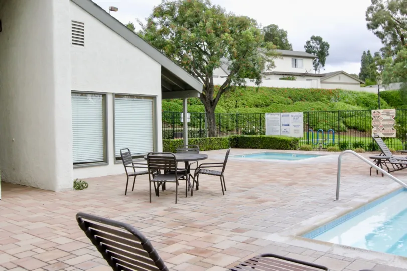 A great day in the Woodgate with table and chairs nearby pool.