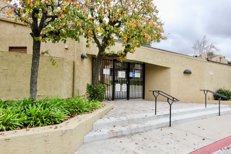 Gated entrance with stairs at Yorba Linda Knolls in Yorba Linda, California on a crisp, fall, day.