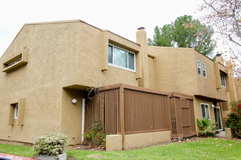 Brown residential housing with large windows and great privacy in the community Yorba Linda Knolls.
