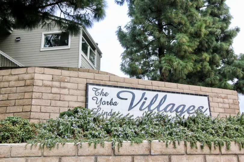 A large villa with the Yorba Linda villages community name inscribed on its compound