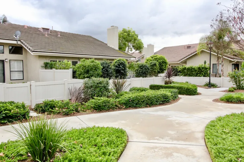 The sunny day in the Yorba Meadowood with villas and gardens.
