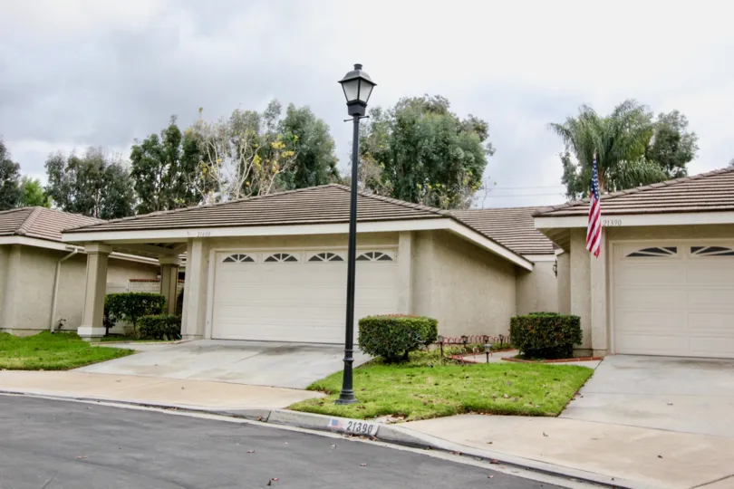 Multiple identical garage and porch openings in Yorba Meadowood community.