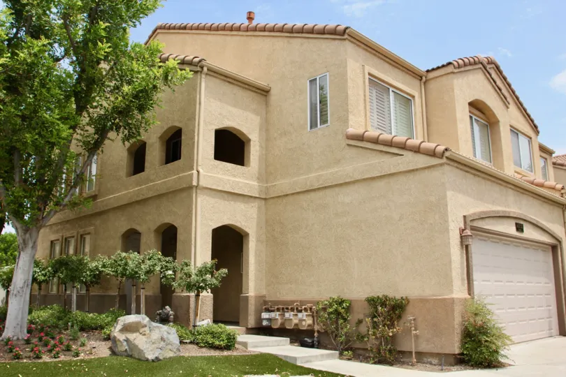 Altia corona California irregular shaped buildings with good roof and decorative trees and plants before the house