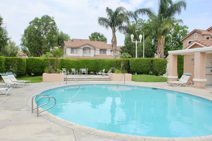 A small red pool sits in a community area at the First Impressions at Corona Hill.