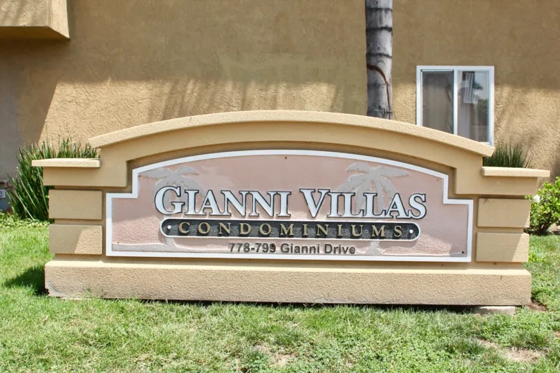 The sign with the address sits in front of the Gianni Villas.