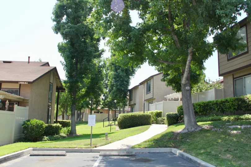 Parking between houses and trees in Laurelwood community