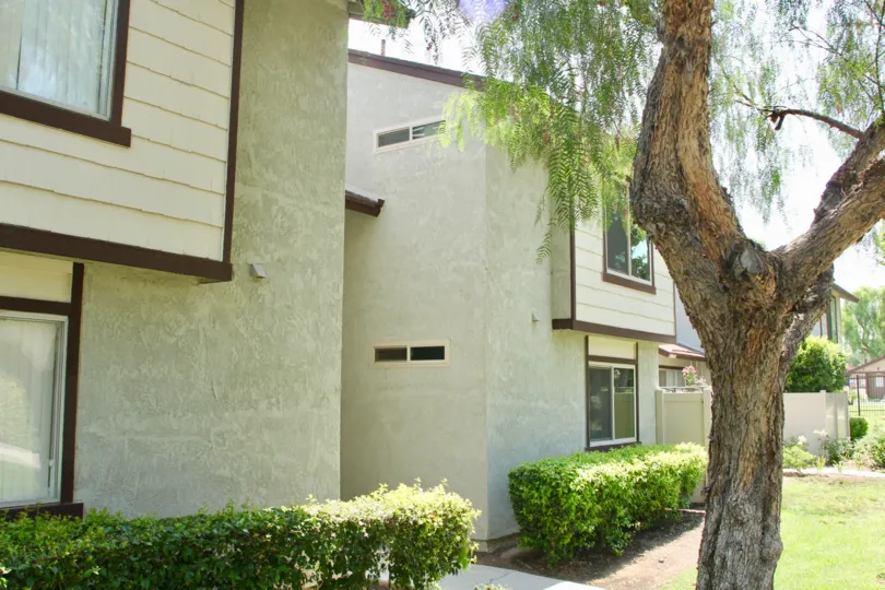 Brown trim sits on beige siding on the second floor of a building in the Laurelwood community.