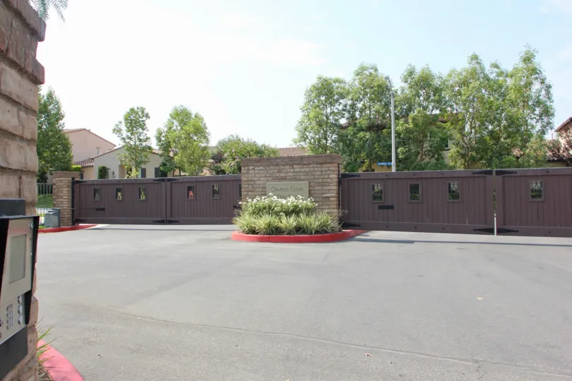 Brown fences are closed on a fence at the entrance of the Shady Grove community.