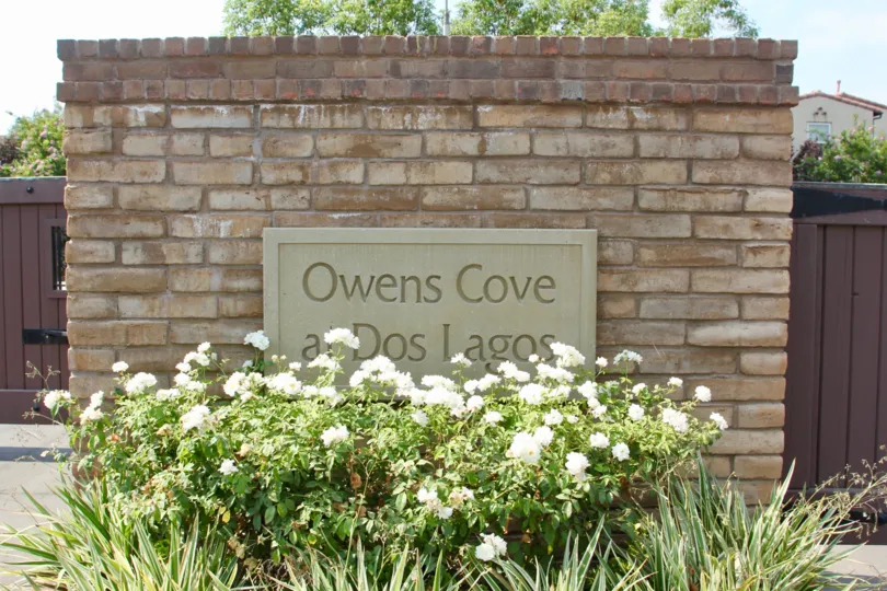 Sign reading "Owens Cove at Dos Lagos" at the Shady Grove community in Corona, CA