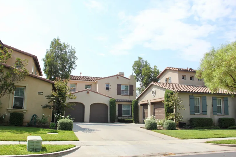 Two arches sit in front of garage doors in the Temescal Heights community.