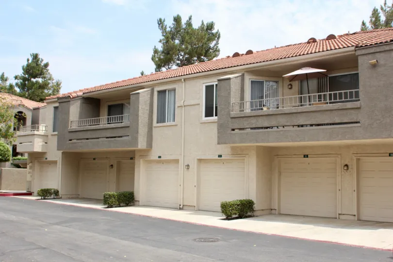Single-family townhomes with attach garage and private balconies.