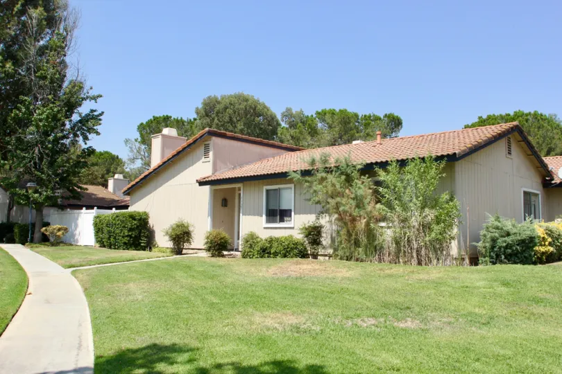 Village Grove Cluster and her cute bungalows with well mowed lawns, Corona, California