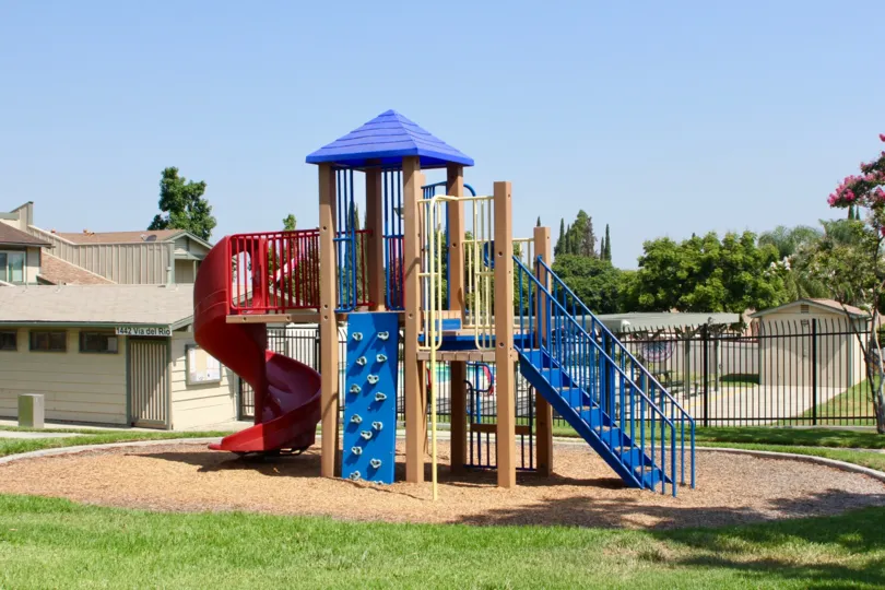 small playing park is placed in front of house where childrens can play and get relaxed