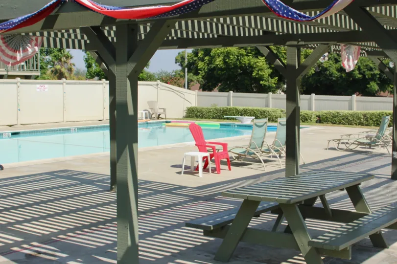 The village grove townhomes are with swimmingfool and sunbath chairs facility