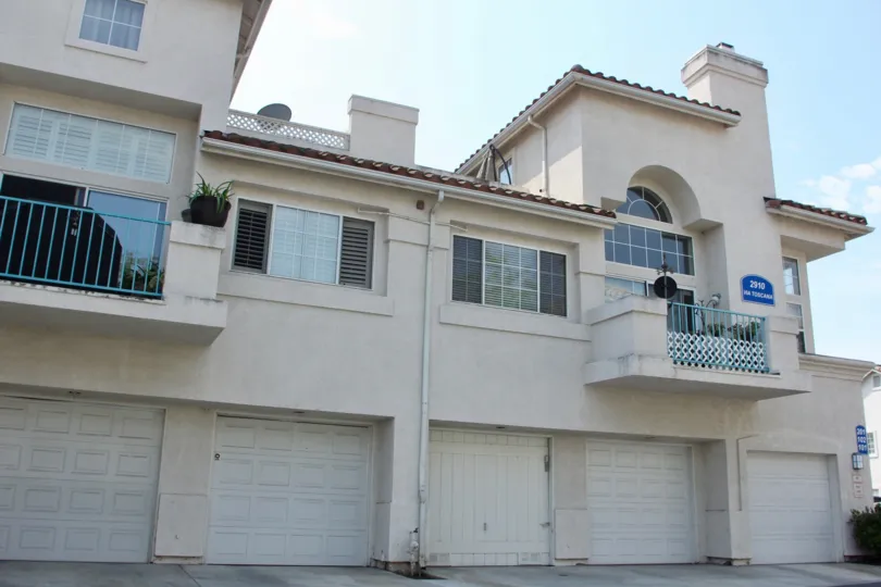 A satellite dish sits on top of a roof of a condo at the Villagio.