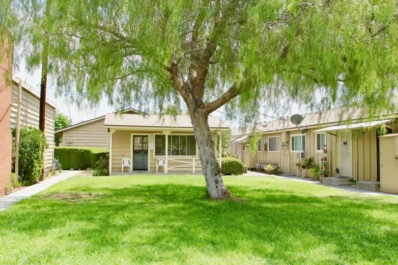 A one-floor wooden housing with a shed in Lake Elsinore Village community.