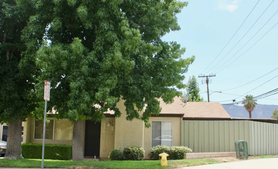 a sunny day in the Parkview Villas with small city