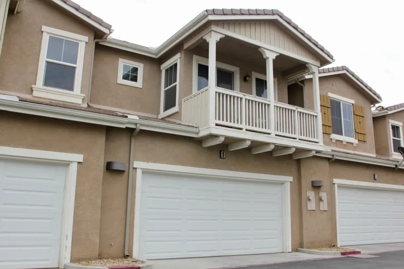 Multi-unite building with large, white garage doors