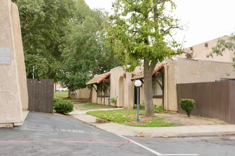 Trees, sidewalk, fencing and homes during a day in the community of Lakeview Sunnymead community in Moreno Valley, California