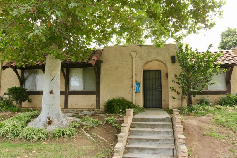 An oak tree in the front lawn of a Spanish style adobe in Lakeview Sunnymead