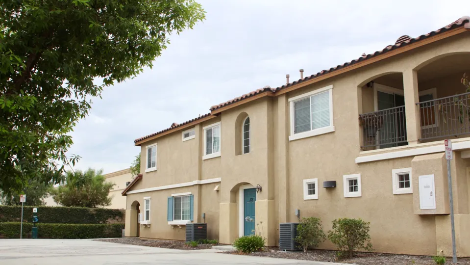 Condo building with outdoor patio covered for protection