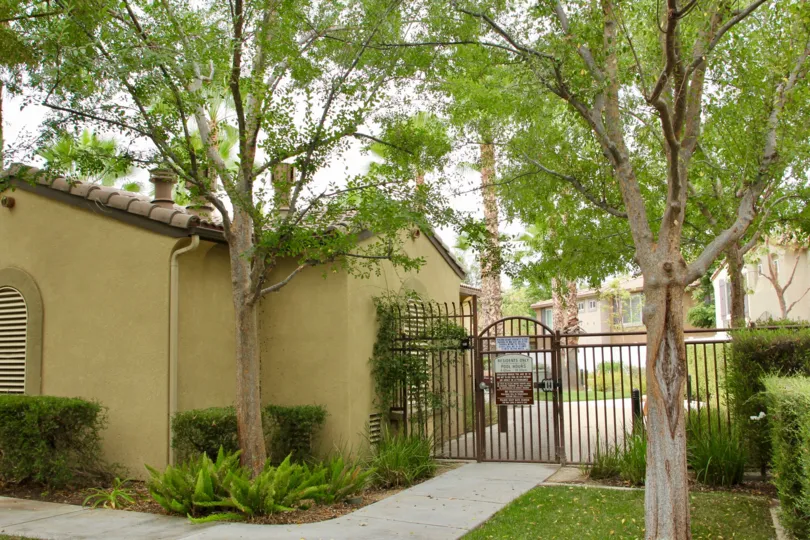 gate area and garden grass and leafs of ferns of promontory pointe