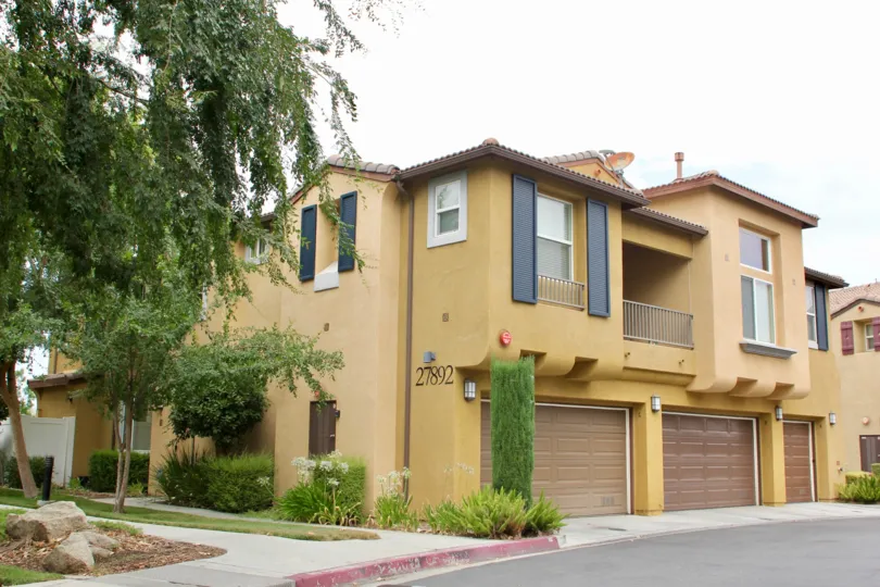Upscale, golden house on cloudy day in Promontory Pointe