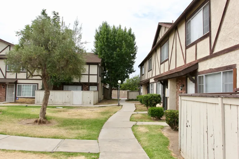 Woodland Villas moreno valley California uniform shaped stripe model building with long walking platform in front